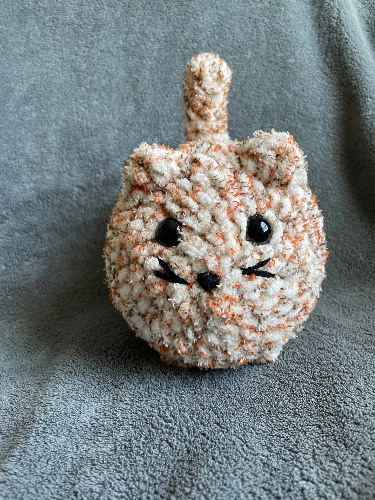 Speckled Orange and Cream Loaf Cat with Black Eyes