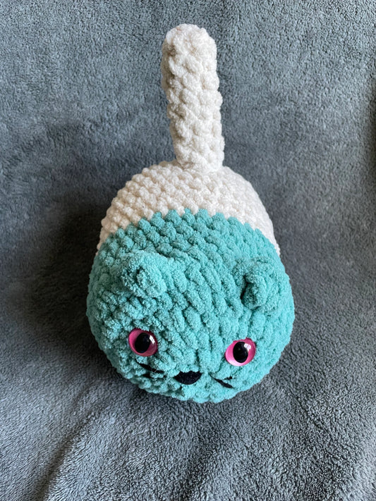 Teal and Cream Loaf Cat with Pink Eyes